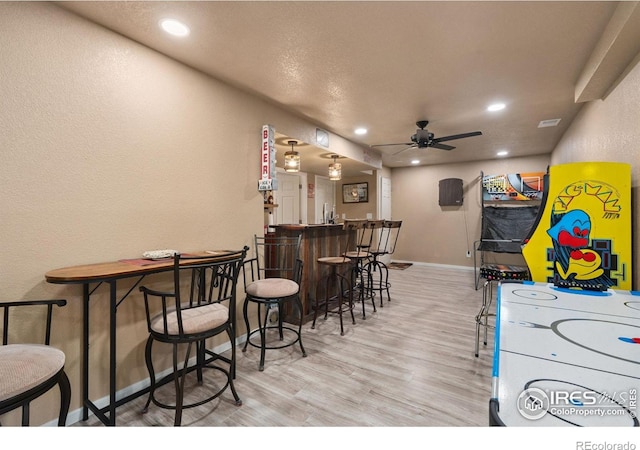 4521 Mesa Verde Dr, Greeley, CO 80634 - game room with wood finished floors, a ceiling fan, recessed lighting, and bar area