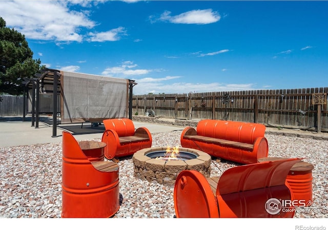 4521 Mesa Verde Dr, Greeley, CO 80634 - fenced backyard featuring a fire pit and a patio area