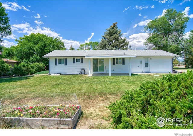 13600 Elmore Rd, Longmont, CO 80504 - rear view of property featuring a yard, a garden, and a patio area