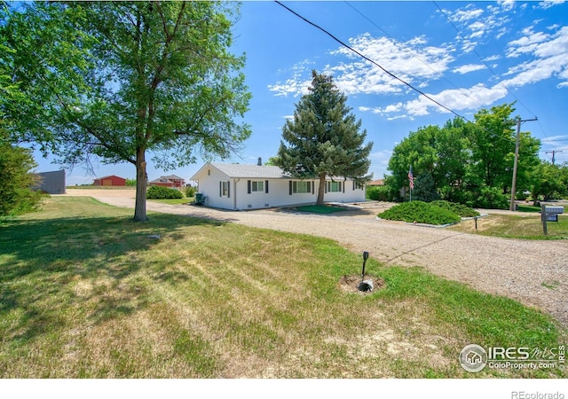 13600 Elmore Rd, Longmont, CO 80504 - ranch-style house featuring a front yard and driveway