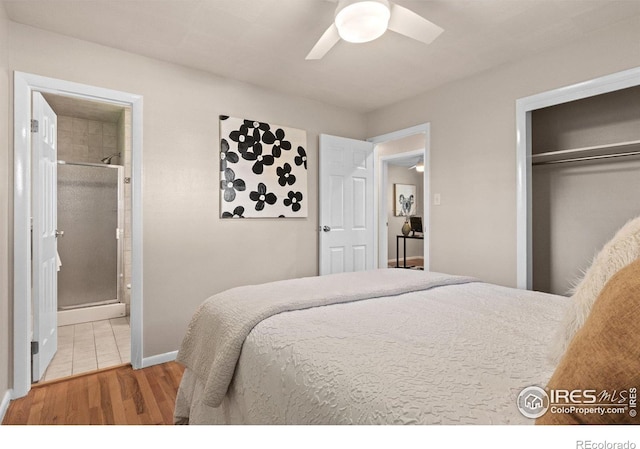 10844 W 68th Ave W, Arvada, CO 80004 - bedroom with wood finished floors, ensuite bathroom, a closet, and a ceiling fan