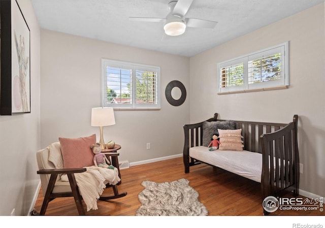 10844 W 68th Ave W, Arvada, CO 80004 - bedroom featuring wood finished floors and ceiling fan