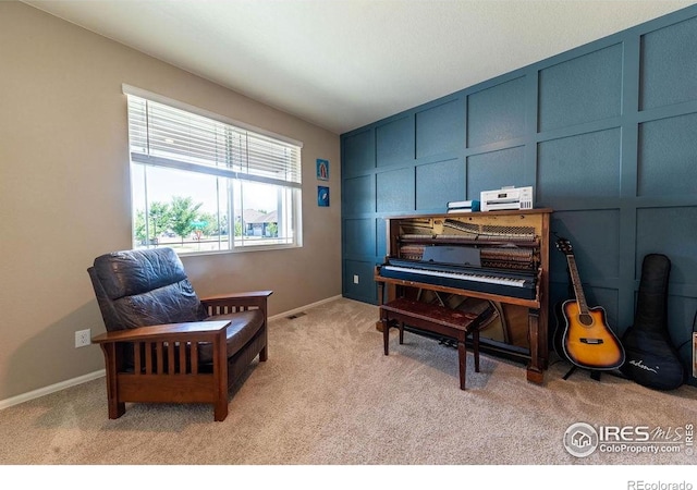 1773 Nightfall Dr, Windsor, CO 80550 - living area featuring light colored carpet and a decorative wall
