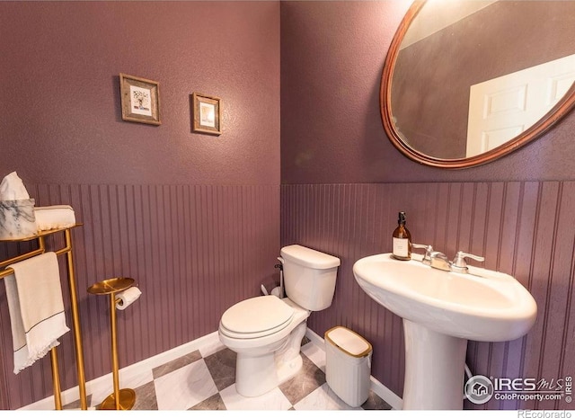 1773 Nightfall Dr, Windsor, CO 80550 - half bathroom with a wainscoted wall