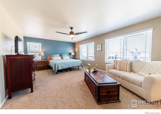1773 Nightfall Dr, Windsor, CO 80550 - bedroom with light carpet and ceiling fan