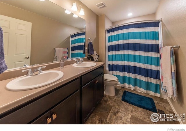 1773 Nightfall Dr, Windsor, CO 80550 - bathroom featuring double vanity and a shower with curtain