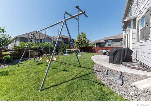 1773 Nightfall Dr, Windsor, CO 80550 - fenced backyard with a playground, an outdoor living space, a patio, and a residential view