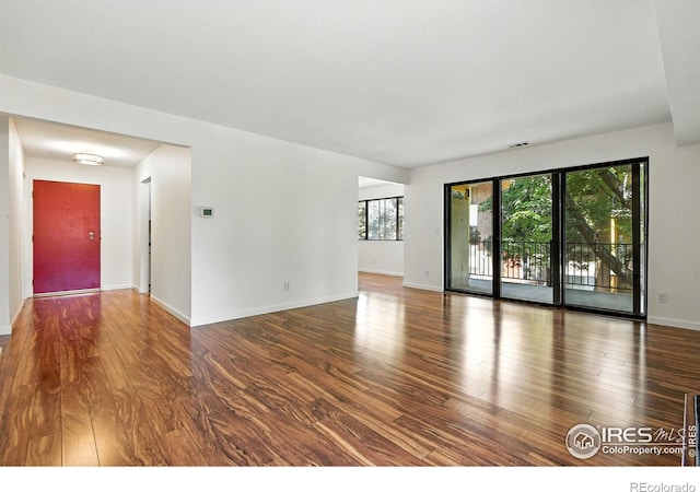 600 Manhattan Dr Unit B7, Boulder, CO 80303 - empty room with wood finished floors and baseboards