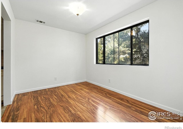 600 Manhattan Dr Unit B7, Boulder, CO 80303 - empty room with wood finished floors and baseboards