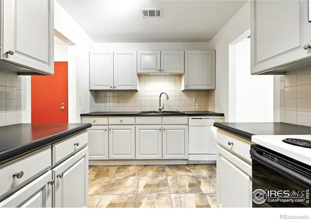 600 Manhattan Dr Unit B7, Boulder, CO 80303 - kitchen with dishwasher, dark countertops, and decorative backsplash