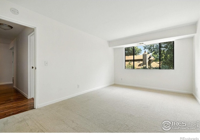 600 Manhattan Dr Unit B7, Boulder, CO 80303 - carpeted empty room with baseboards and a smoke detector