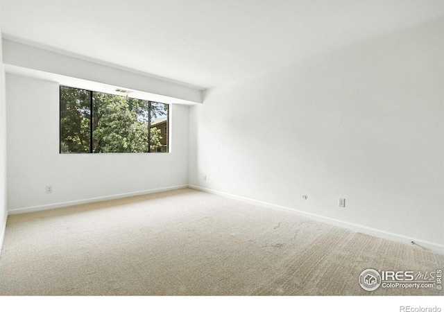 600 Manhattan Dr Unit B7, Boulder, CO 80303 - carpeted empty room featuring baseboards