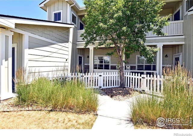 3641 29th St Unit 6, Greeley, CO 80634 - doorway to property with board and batten siding