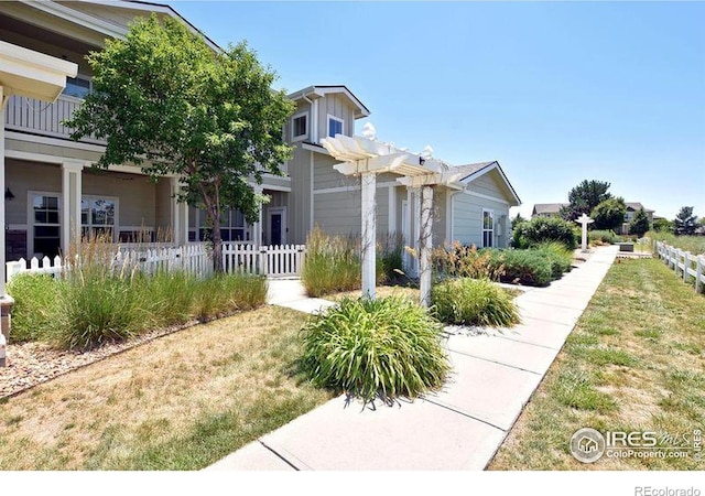 3641 29th St Unit 6, Greeley, CO 80634 - obstructed view of property featuring a pergola and board and batten siding
