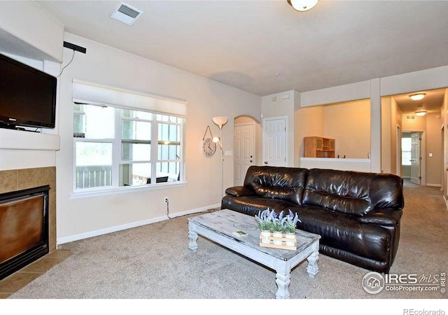 3641 29th St Unit 6, Greeley, CO 80634 - carpeted living room with arched walkways and a tile fireplace
