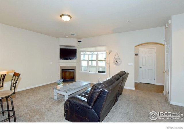 3641 29th St Unit 6, Greeley, CO 80634 - carpeted living area featuring a fireplace and arched walkways