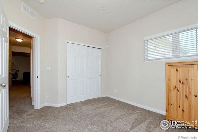 3641 29th St Unit 6, Greeley, CO 80634 - unfurnished bedroom featuring carpet and a closet