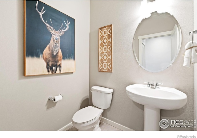 2233 Base St, Fort Lupton, CO 80621 - half bathroom with toilet and baseboards