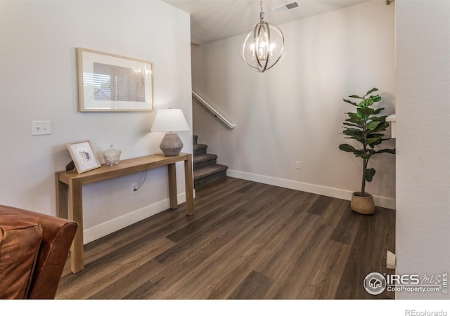 2402 49th Avenue Ct Unit 17, Greeley, CO 80634 - staircase with wood finished floors and a chandelier