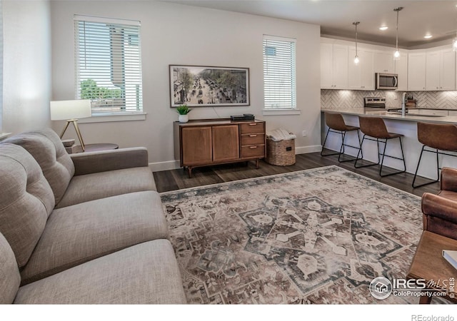 2402 49th Avenue Ct Unit 17, Greeley, CO 80634 - living room with dark wood-type flooring and recessed lighting