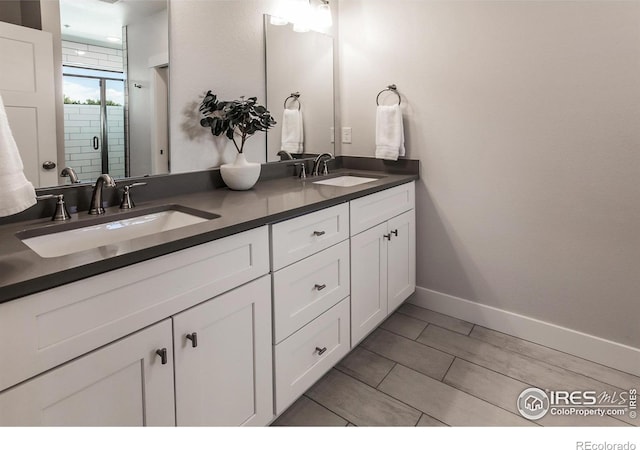 2402 49th Avenue Ct Unit 17, Greeley, CO 80634 - bathroom with double vanity and a shower stall