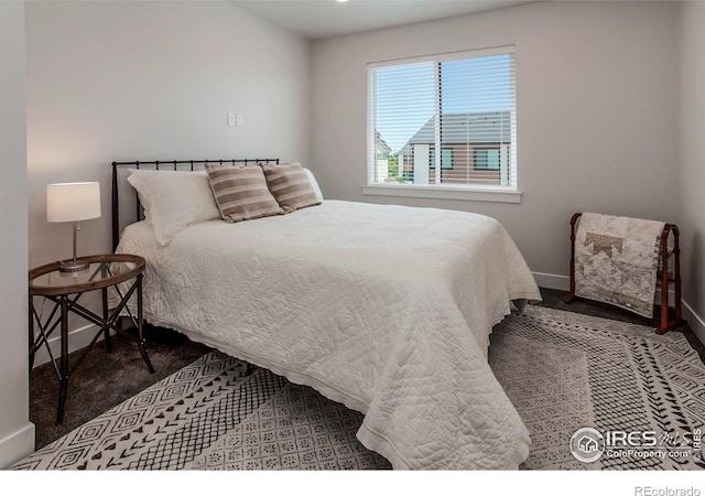 2402 49th Avenue Ct Unit 17, Greeley, CO 80634 - carpeted bedroom with baseboards