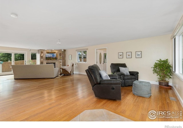 10947 Lynne Ave, Lafayette, CO 80026 - living area with wood finished floors and a fireplace