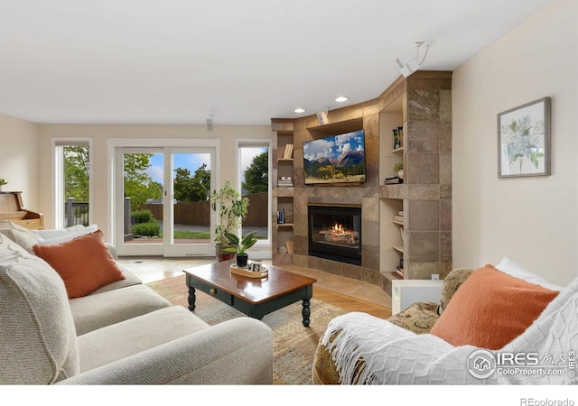 10947 Lynne Ave, Lafayette, CO 80026 - living room featuring built in features, a fireplace, and recessed lighting