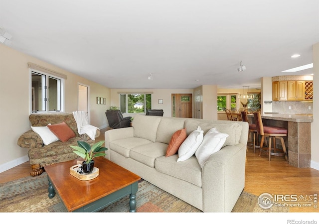 10947 Lynne Ave, Lafayette, CO 80026 - living area featuring healthy amount of natural light, light wood-type flooring, and recessed lighting