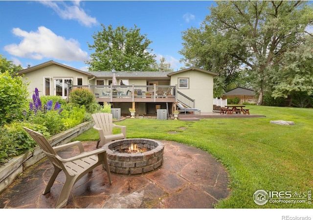 10947 Lynne Ave, Lafayette, CO 80026 - back of property with a fire pit, a patio, a deck, a yard, and stairs