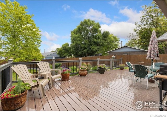 10947 Lynne Ave, Lafayette, CO 80026 - wooden terrace featuring outdoor dining area
