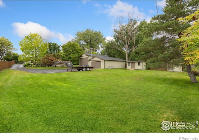 10947 Lynne Ave, Lafayette, CO 80026 - view of yard with a garage and an outbuilding