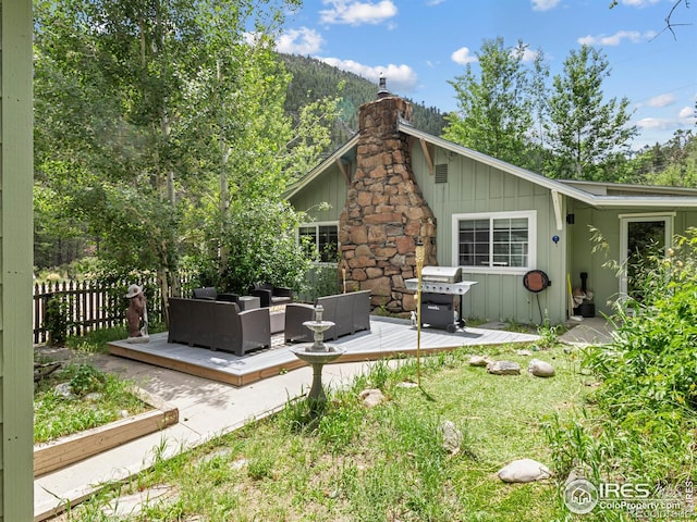2301 US Highway 34, Drake, CO 80515 - rear view of property with an outdoor living space, a deck, board and batten siding, and a chimney