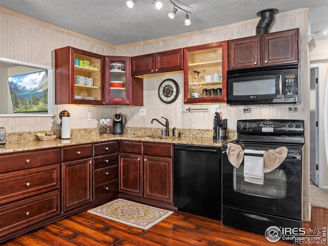 2301 US Highway 34, Drake, CO 80515 - kitchen with black appliances, dark wood-type flooring, light stone countertops, ornamental molding, and a textured ceiling