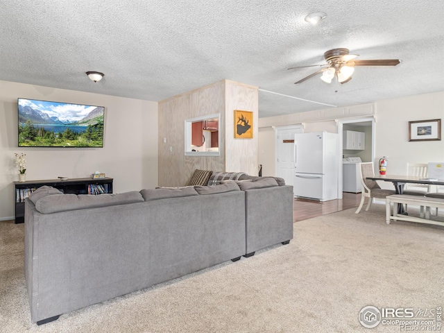 2301 US Highway 34, Drake, CO 80515 - living room featuring washer / dryer, ceiling fan, carpet flooring, and a textured ceiling