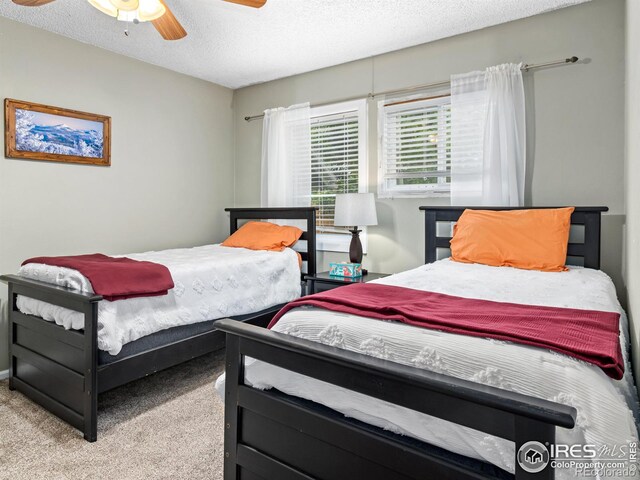 2301 US Highway 34, Drake, CO 80515 - bedroom with carpet floors, a textured ceiling, and a ceiling fan