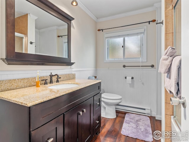 2301 US Highway 34, Drake, CO 80515 - full bath with a baseboard radiator, vanity, ornamental molding, a wainscoted wall, and wood finished floors