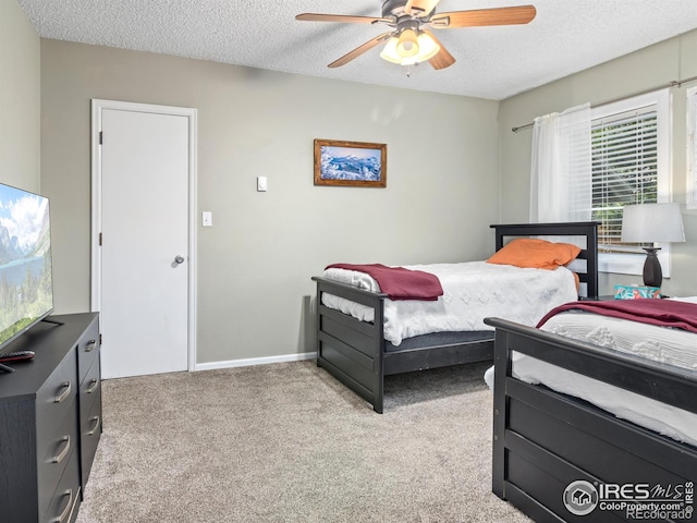 2301 US Highway 34, Drake, CO 80515 - bedroom with a textured ceiling, light carpet, and ceiling fan