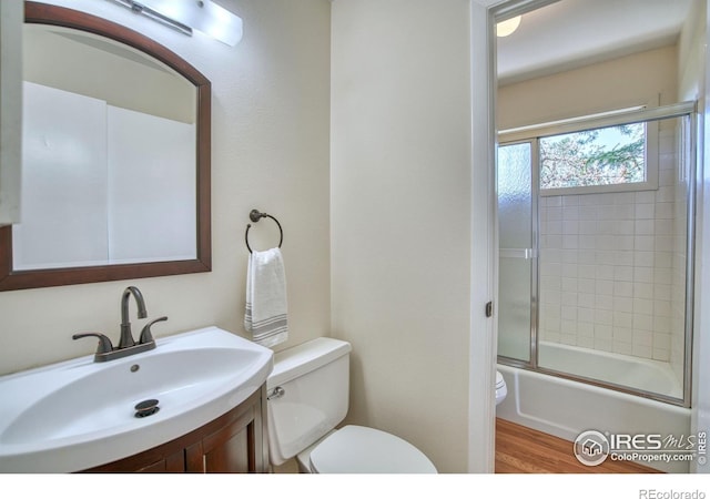 1925 28th Ave Unit 30, Greeley, CO 80634 - bathroom with vanity, combined bath / shower with glass door, and wood finished floors