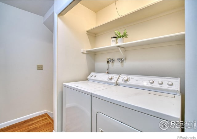 1925 28th Ave Unit 30, Greeley, CO 80634 - washroom with independent washer and dryer and light wood finished floors