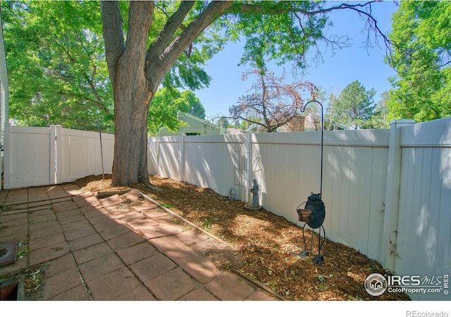 1925 28th Ave Unit 30, Greeley, CO 80634 - fenced backyard with a patio area
