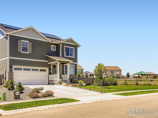 1591 Sun River Rd, Berthoud, CO 80513 - craftsman-style home featuring roof mounted solar panels, concrete driveway, and a garage