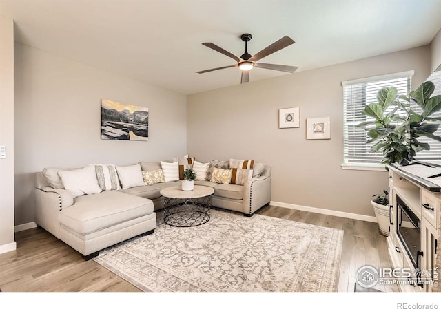 1591 Sun River Rd, Berthoud, CO 80513 - living room with light wood finished floors and ceiling fan