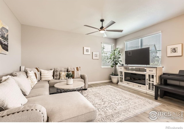 1591 Sun River Rd, Berthoud, CO 80513 - living room with a ceiling fan and wood finished floors