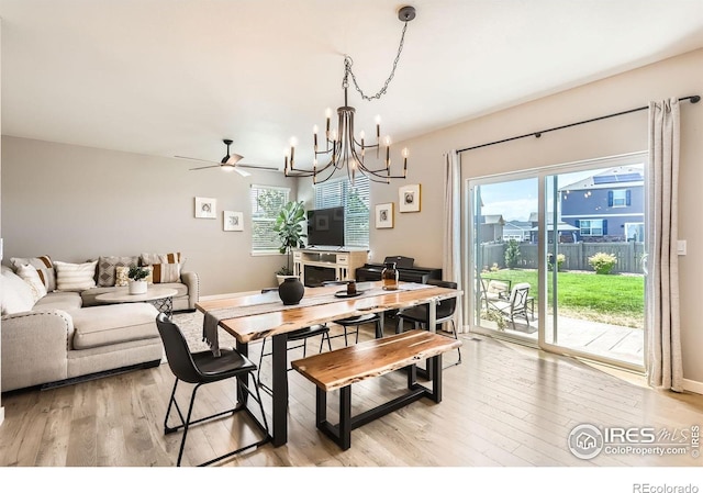 1591 Sun River Rd, Berthoud, CO 80513 - dining area featuring a chandelier, light wood finished floors, and a ceiling fan