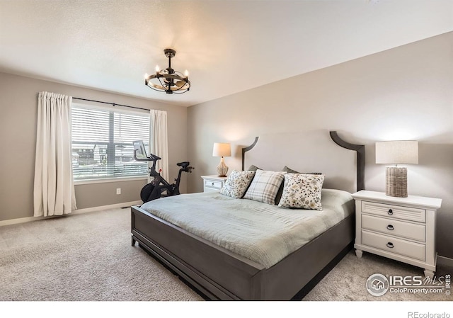 1591 Sun River Rd, Berthoud, CO 80513 - bedroom with a chandelier and carpet flooring