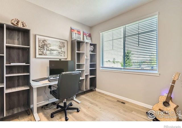 1591 Sun River Rd, Berthoud, CO 80513 - office area with wood finished floors and baseboards