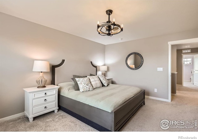 1591 Sun River Rd, Berthoud, CO 80513 - bedroom with a chandelier and light carpet