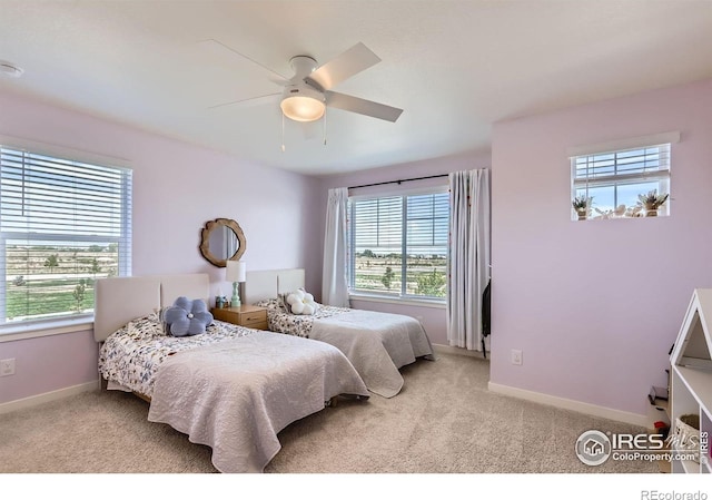 1591 Sun River Rd, Berthoud, CO 80513 - bedroom with light colored carpet and ceiling fan