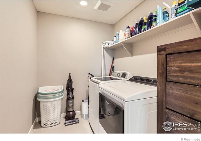 1591 Sun River Rd, Berthoud, CO 80513 - washroom with washer and clothes dryer and tile patterned flooring